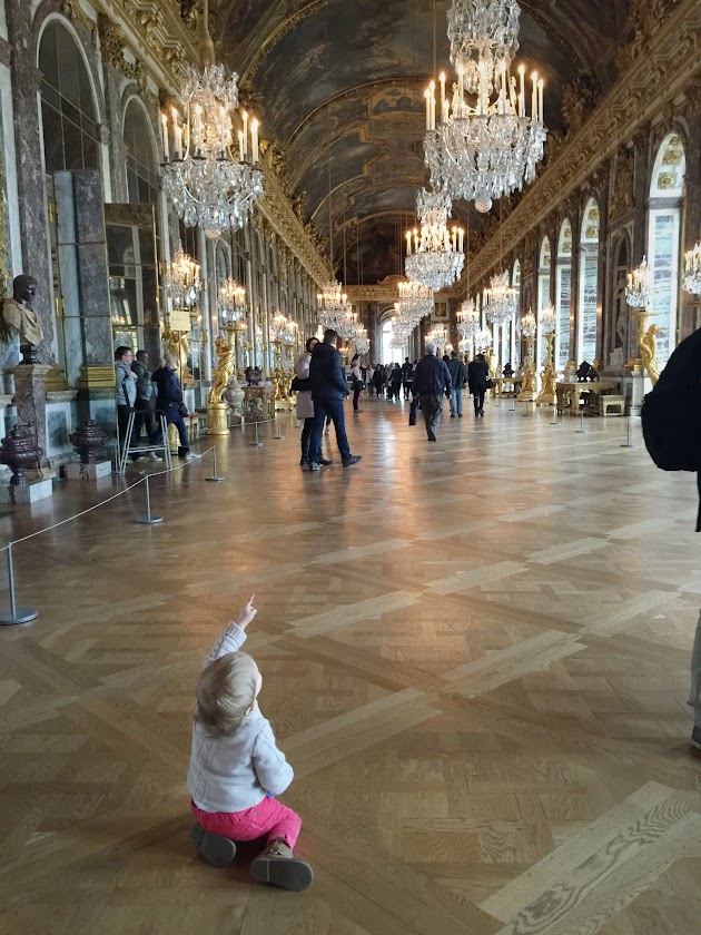 the hall of mirrors today, with a young child sitting on the floor